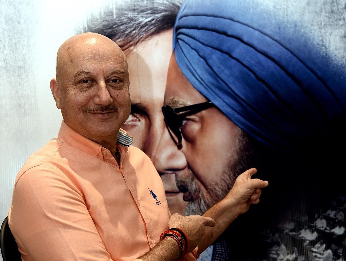 Bollywood actor Anupam Kher poses for a picture during a promotional event for 'The Accidental Prime Minister', (AFP Photo)