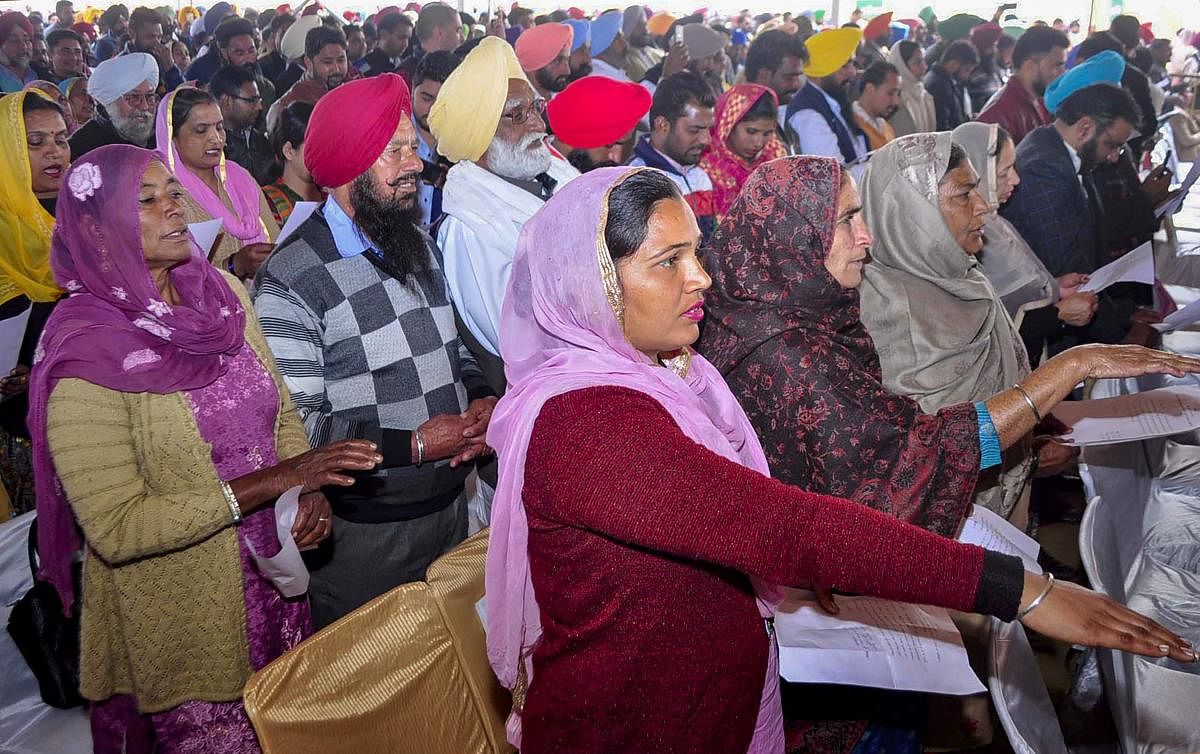 Sarpanch and Panchs take othe during the swearing-in ceremony at Baran village, Patiala district, Friday, Jan. 11, 2019.