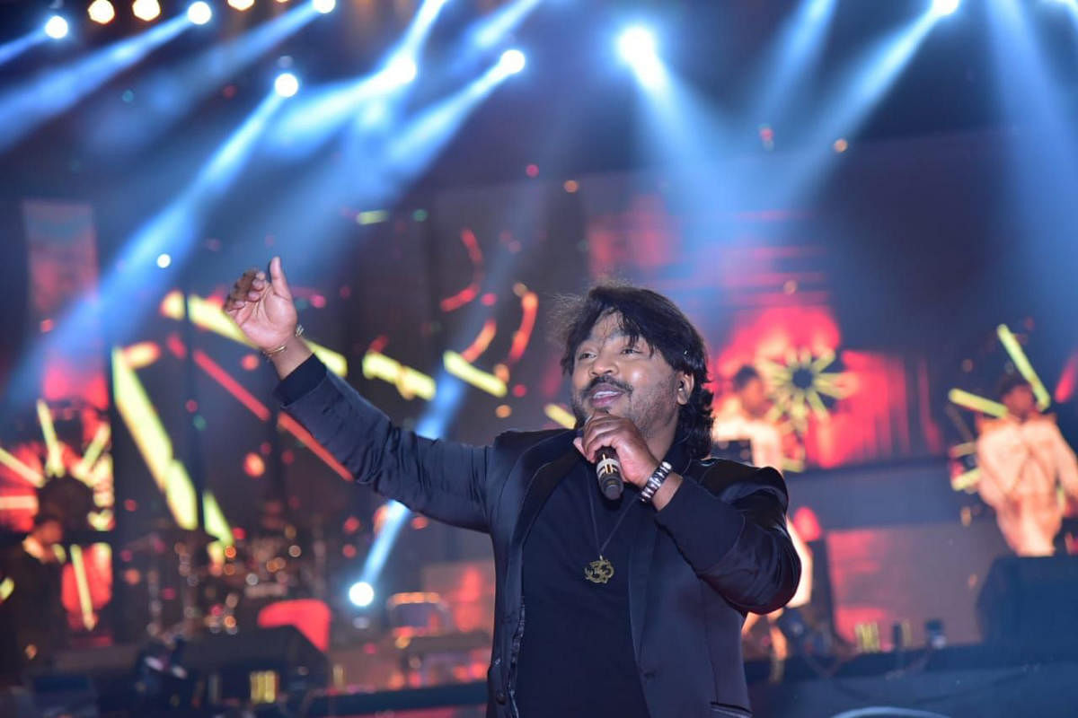 Music director Arjun Janya entertains the audience as apart of the Kodagu Pravasi Utsav 2019 at Gandhi Maidan in Madikeri.