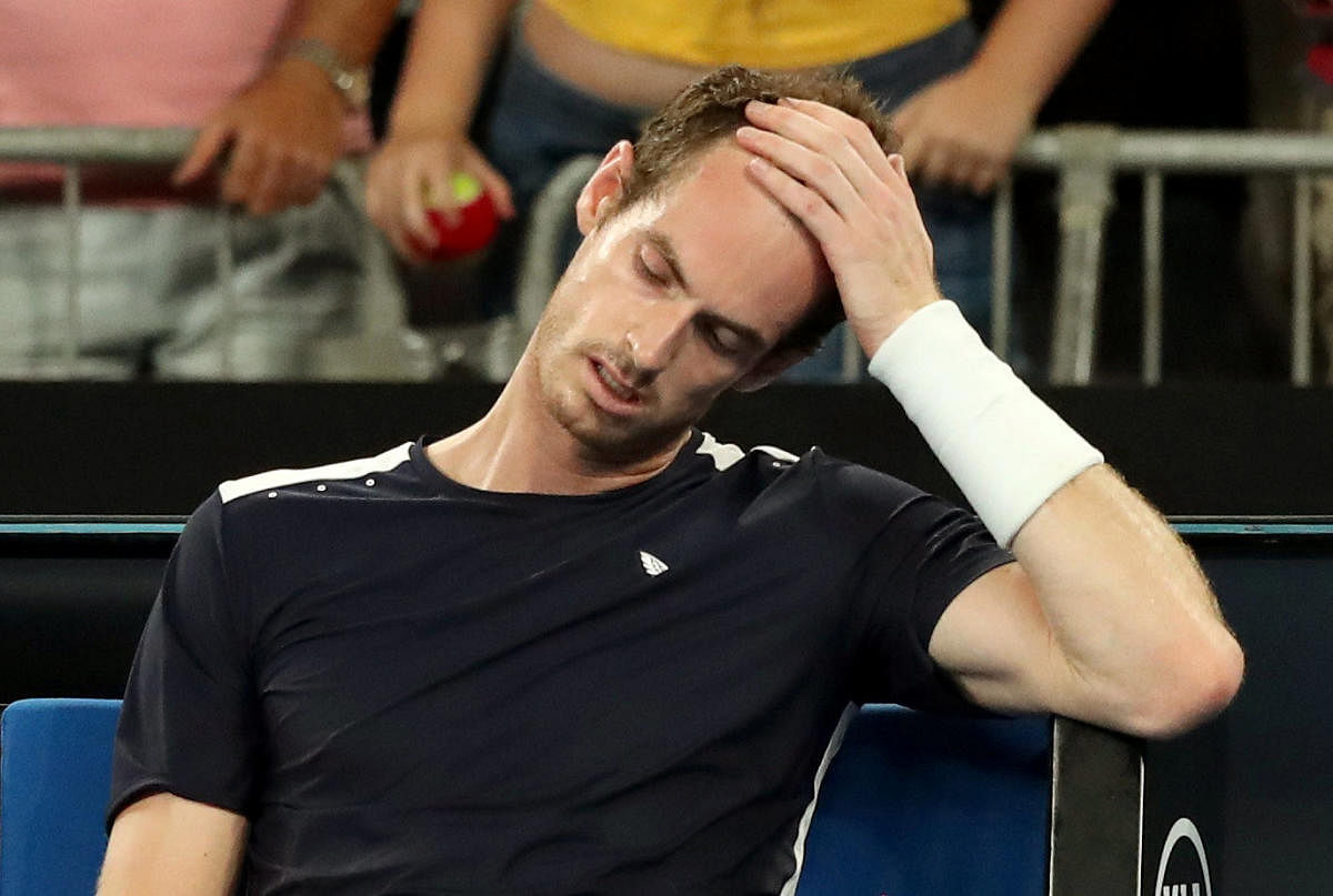 PAINFUL EXIT Britain's Andy Murray looks dejected after losing the first-round match against Spain's Roberto Bautista Agut on Monday. Reuters