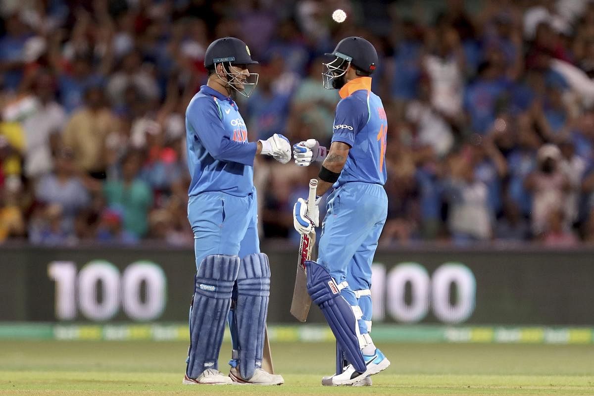 India's Virat Kohli celebrates his 100 against Australia with teammate M.S. Dhoni during their one day international cricket match in Adelaide, Australia, Tuesday, Jan. 15, 2019. (AP/PTI)