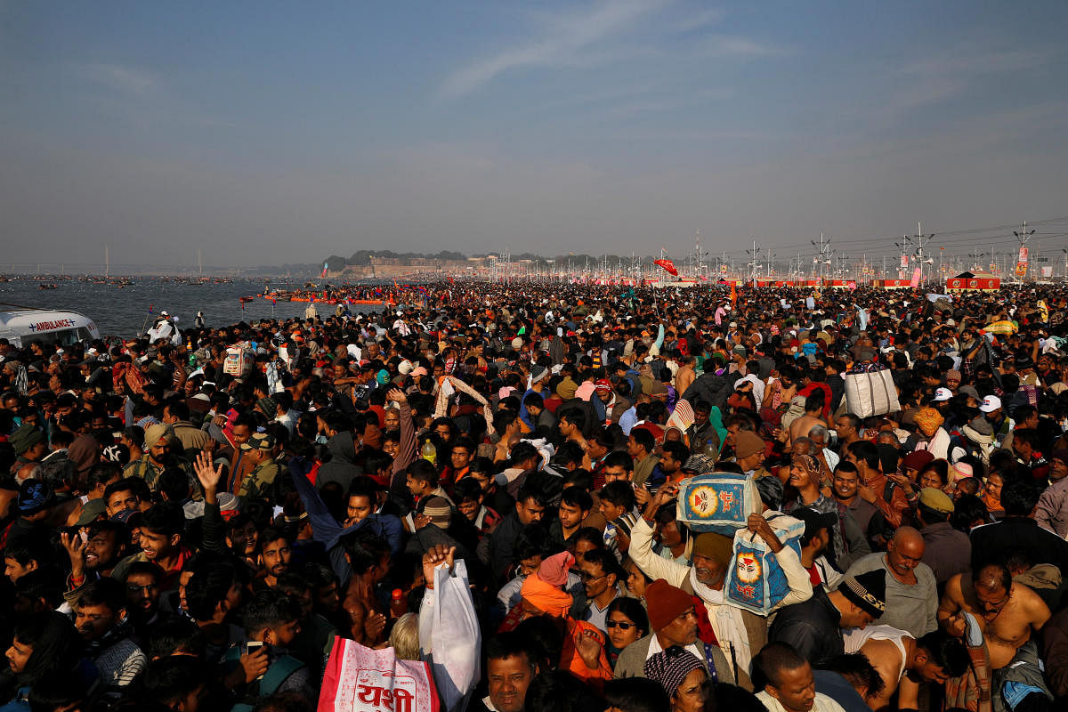 Devotees arrive to take a dip during the first "Shahi Snan" (grand bath) at "Kumbh Mela" or the Pitcher Festival, in Prayagraj, previously known as Allahabad, India, January 15, 2019. (REUTERS)