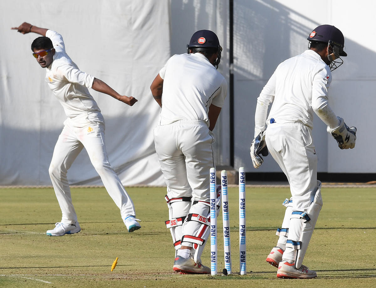 CASTLED: Karnataka off-spinner K Gowtham celebrates after bowling Rajasthan's Rahul Chahar on the opening day of their Ranji Trophy quarterfinal at the M Chinnaswamy Stadium in Bengaluru on Tuesday. DH Photo/ Srikanta Sharma R