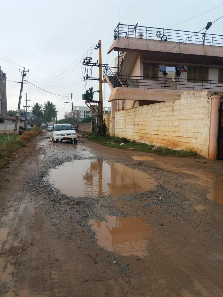 The unasphalted Thubarahalli Road where residents struggle to commute, especially during the rain.