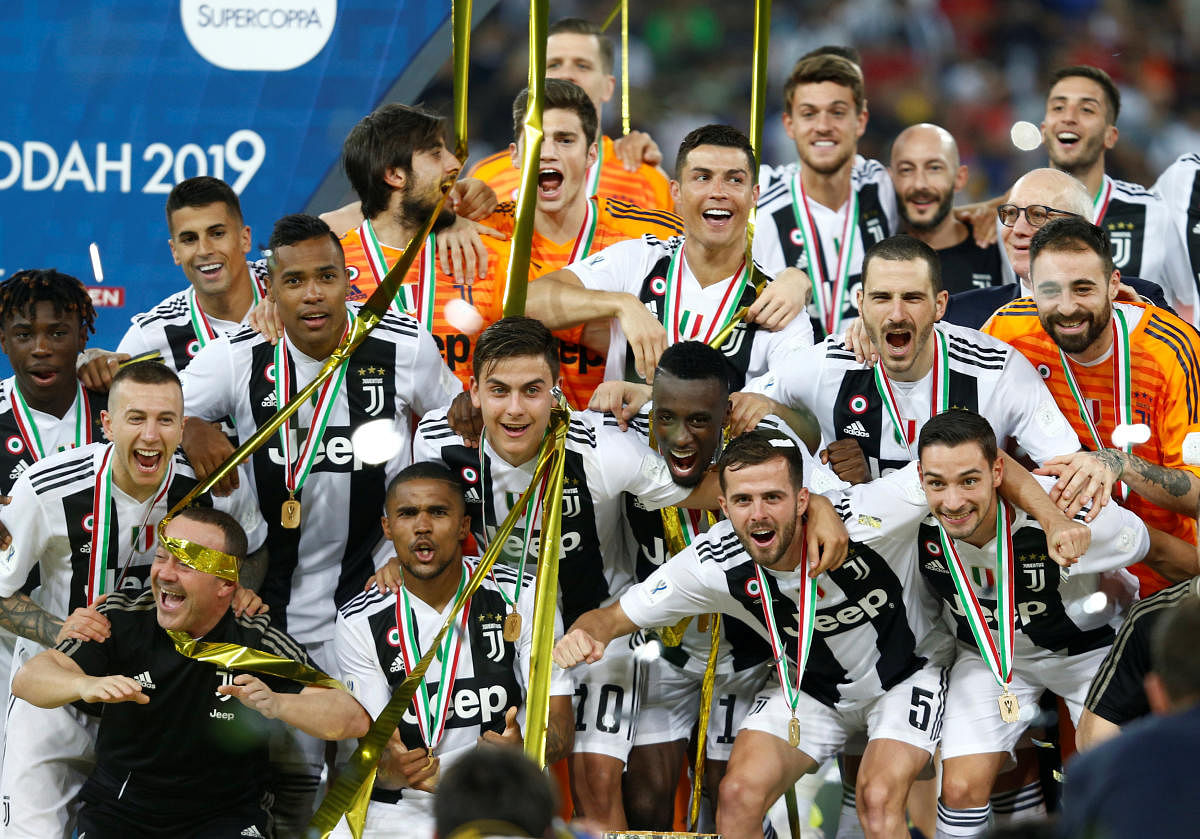 Juventus players celebrate after winning the Italian Super Cup. (Reuters Photo)