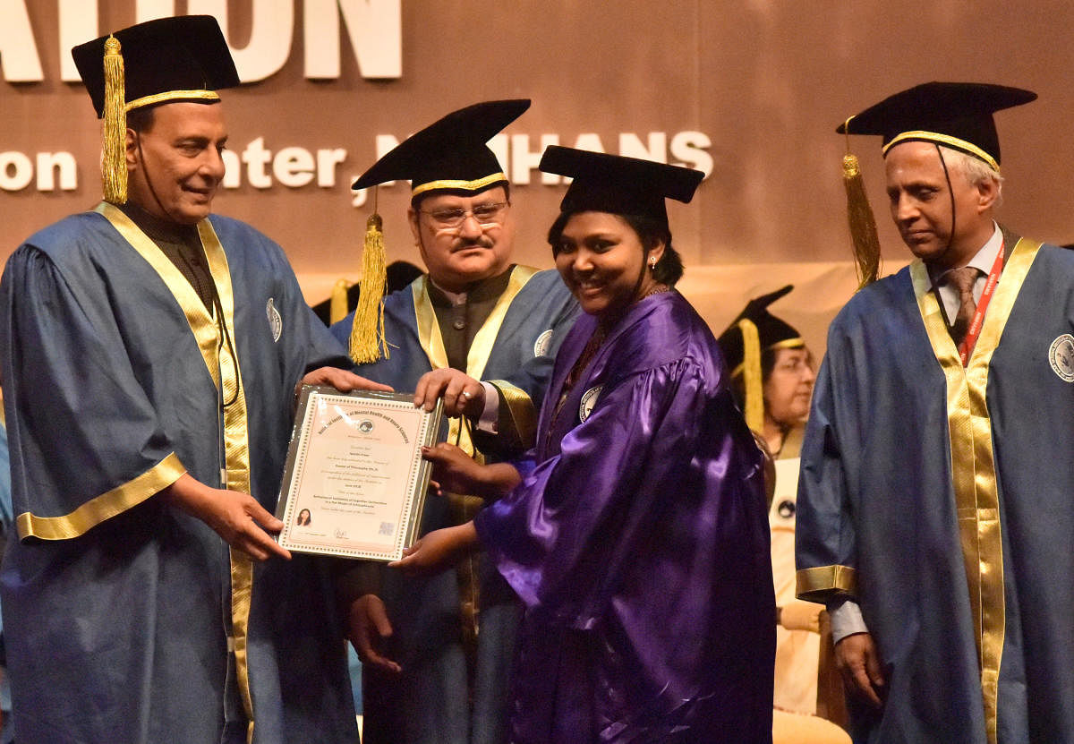 Union Minister for Home Affairs Rajnath Singh confers a degree on Neethi Prem during the 23rd Convocation of National Institute of Mental Health and Neuro Sciences (Nimhans) in Bengaluru on Saturday. Union Minister for Health and Family Welfare J P Nadda