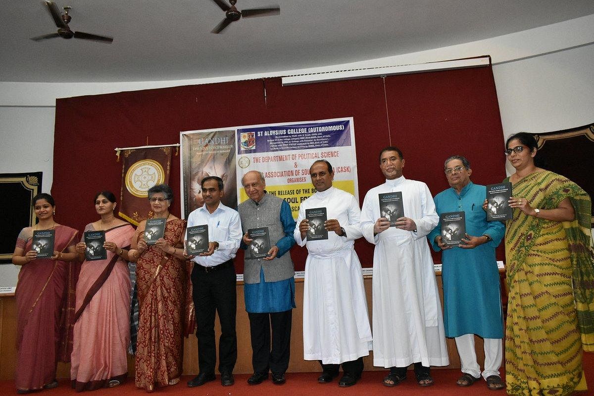 Dignitaries release the book ‘Gandhi: The Soul Force Warrior’, authored by retired ambassador Pascal Alan Nazareth, at St Aloysius College in Mangaluru.