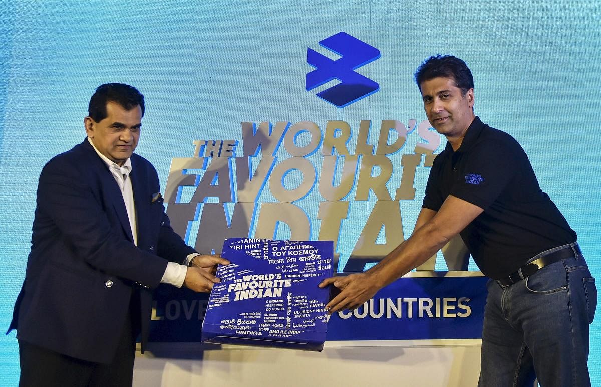 NITI Aayog CEO Amitabh Kant being felicitated by Bajaj Auto MD Rajiv Bajaj during an event, in New Delhi on Monday. PTI