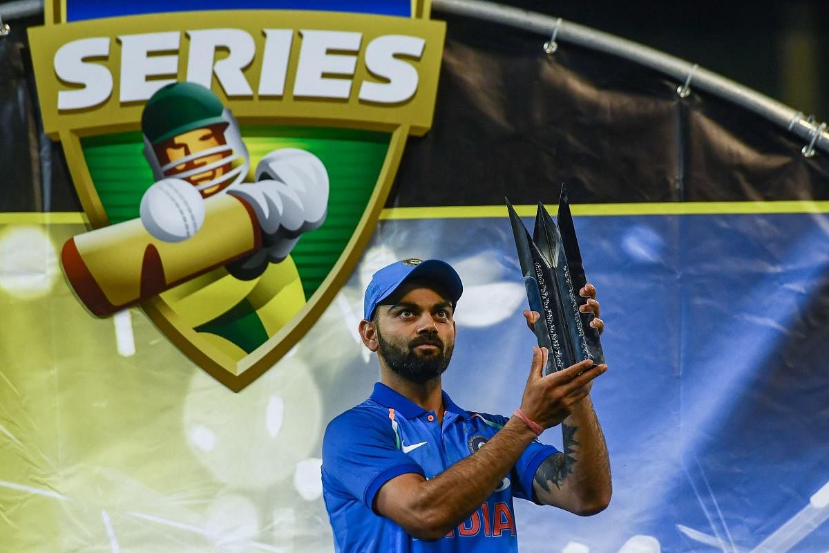 India's captain Virat Kohli holds up the team's one-day international series trophy after defeating Australia at the Melbourne Cricket Ground in Melbourne. AFP File photo