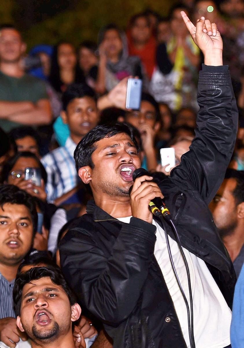 Former JNUSU president Kanhaiya Kumar raises slogans at the JNU campus upon his release on bail, in New Delhiin 2016. PTI File Photo