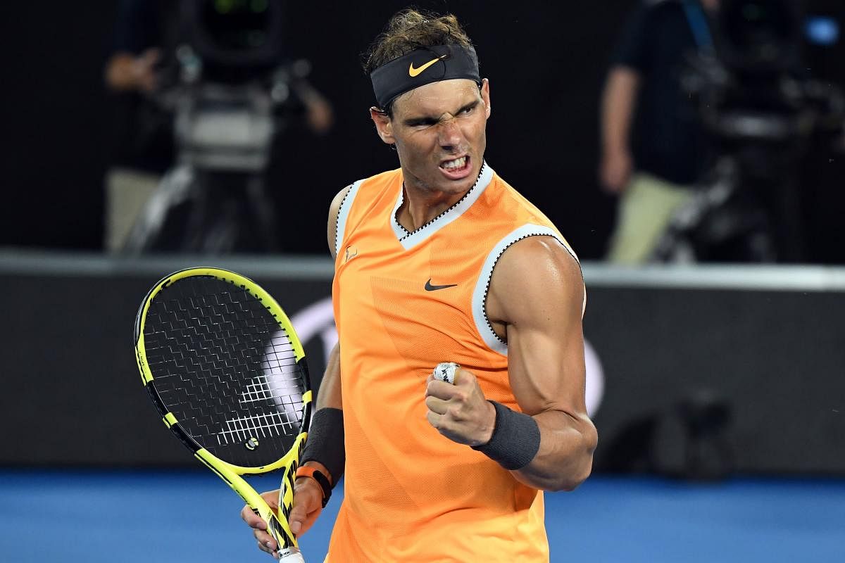 Spain's Rafael Nadal celebrates his victory against Frances Tiafoe of the US during their men's singles quarter-final match on day nine of the Australian Open tennis tournament in Melbourne. AFP Photo