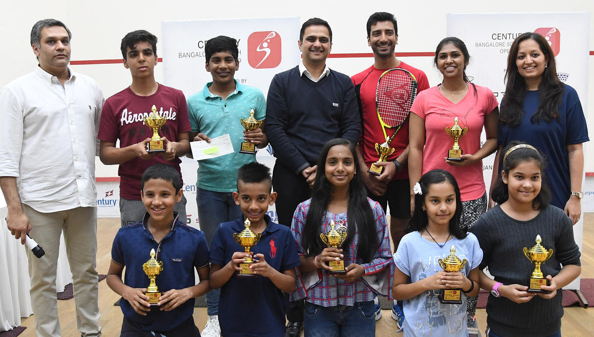 All smiles: Winners of the 5Sports Century Bengaluru Open Squash tournament in Bengaluru on Wednesday. STANDING: FROM LEFT: Jay Javeri (Partner, 5Sports), Ekam Singh (Boys, U-15), Navaneeth Prabhu S (Boys, U-17), Ravi Pai (MD, Century Real Estate), Gaurav