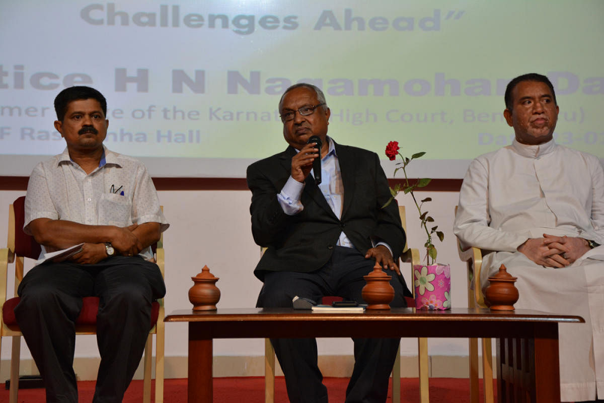 Former Karnataka High Court judge Justice H N Nagamohan Das speaksto students during an interactive session organised as a part of the Constitution Week at L F Rasquinha Hall in St Aloysius College on Wednesday.
