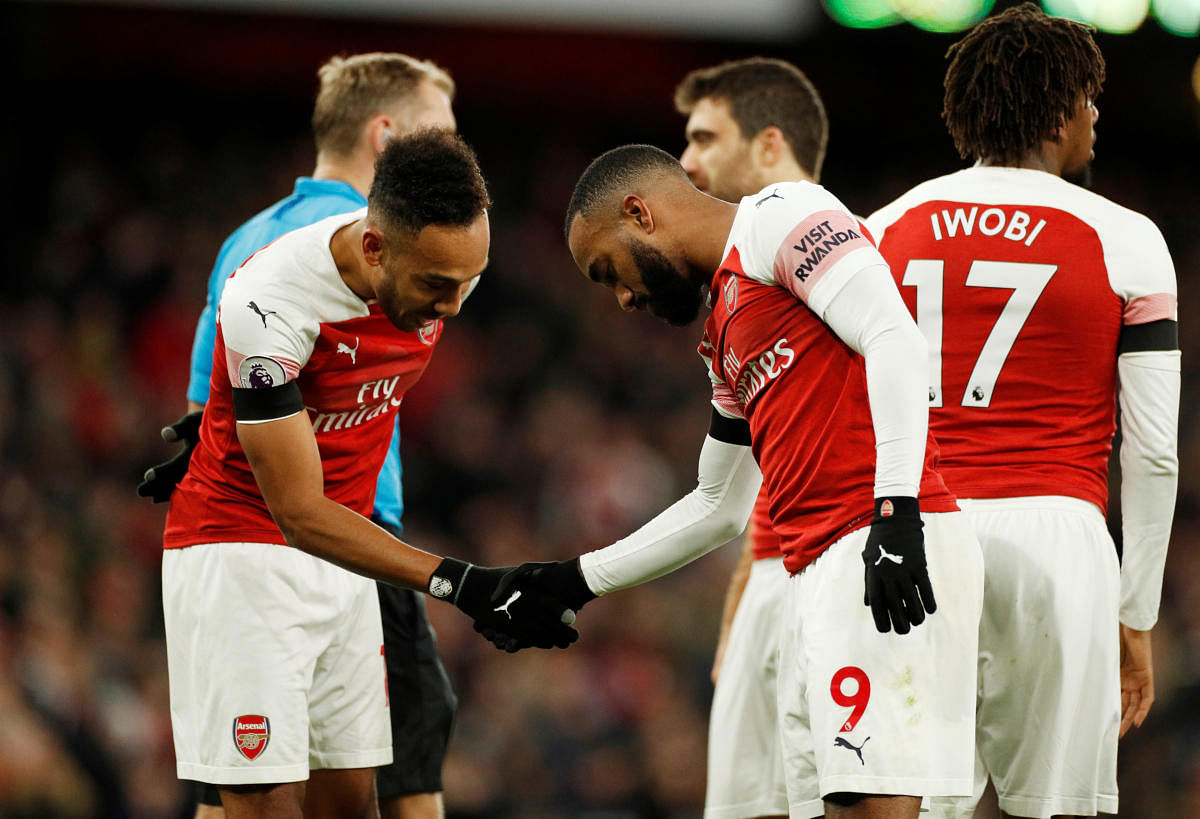 Strikers Alexandre Lacazette (right) and Pierre-Emerick Aubameyang have to be at their best if Arsenal looks to take down a resurgent Manchester United on Friday. Reuters