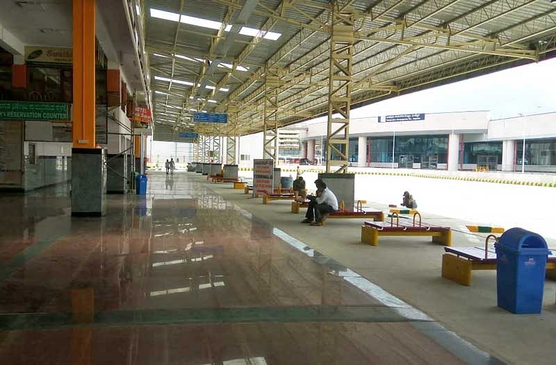 Manikanta, a native of KR Pete in Mandya district works as a labourer in the city and was waiting for a bus to return to his native at the KSRTC bus terminal no. 2 on the wee hours of January 23. (DH File Photo)