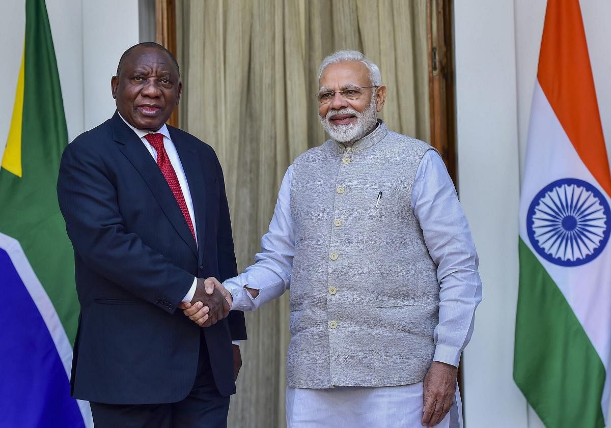Prime Minister Narendra Modi greets South African President Cyril Ramaphosa prior to a meeting at Hyderabad House in New Delhi on Friday. PTI file photo