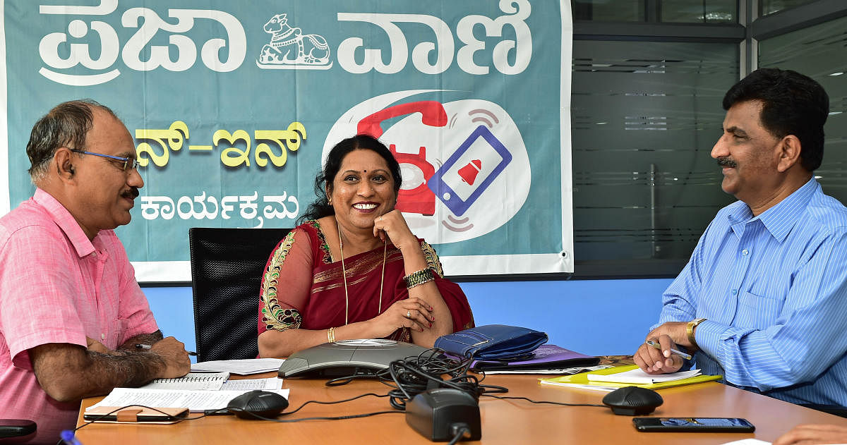 Director of Karnataka Secondary Education Examination Board V Sumangala answers queries during the phone-in programme organised by Prajavani at its office in Bengaluru on Friday. Senior Assistant Directors K M Gangadharaswamy and Shekharappa are seen. DH