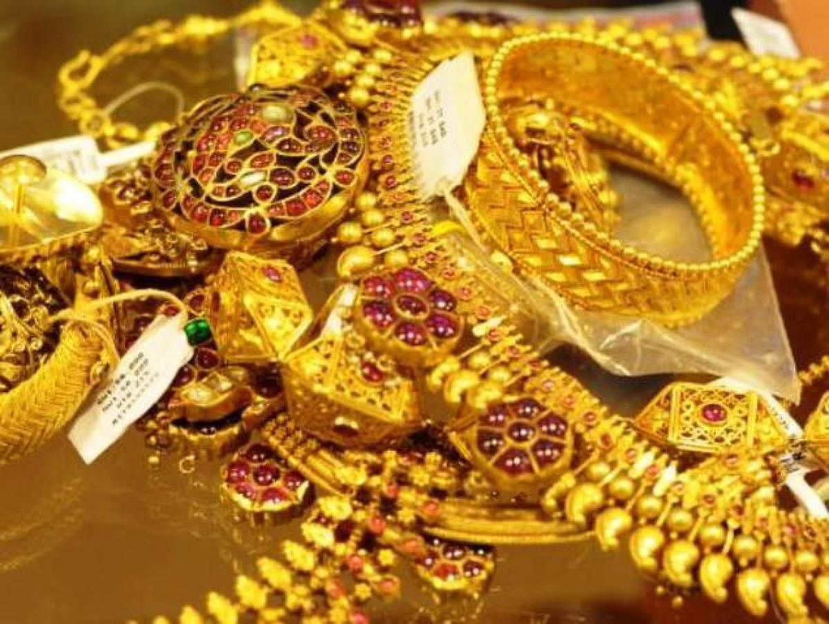 Overcoming a mixed sentiment from global markets, gold prices climbed on account of favourable domestic cues like wedding season demand from local jewellers as well as retailers.