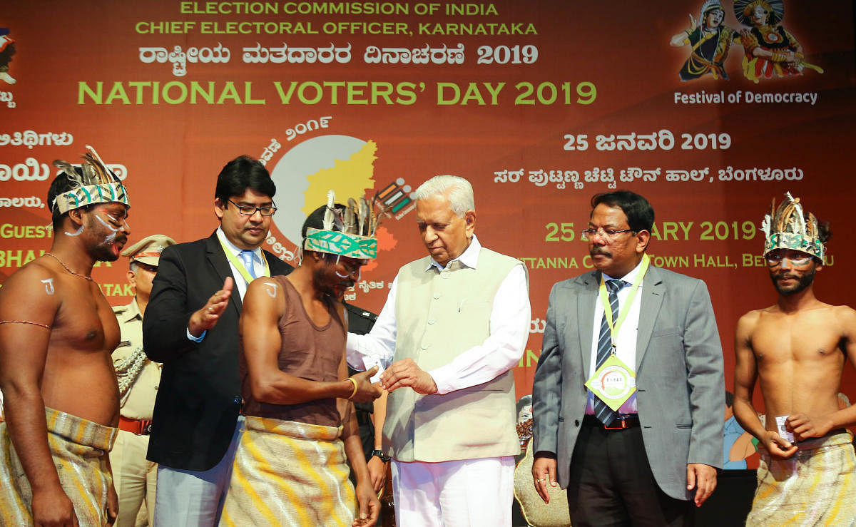 Governor Vajubhai Vala distributed the Electoral Photo Identity Cards (EPIC) to the newly enrolled voters on the occasion of National Voters Day Celebration program at Town Hall, organised by Election Commission of India, in Bengaluru on Friday 25th Janua