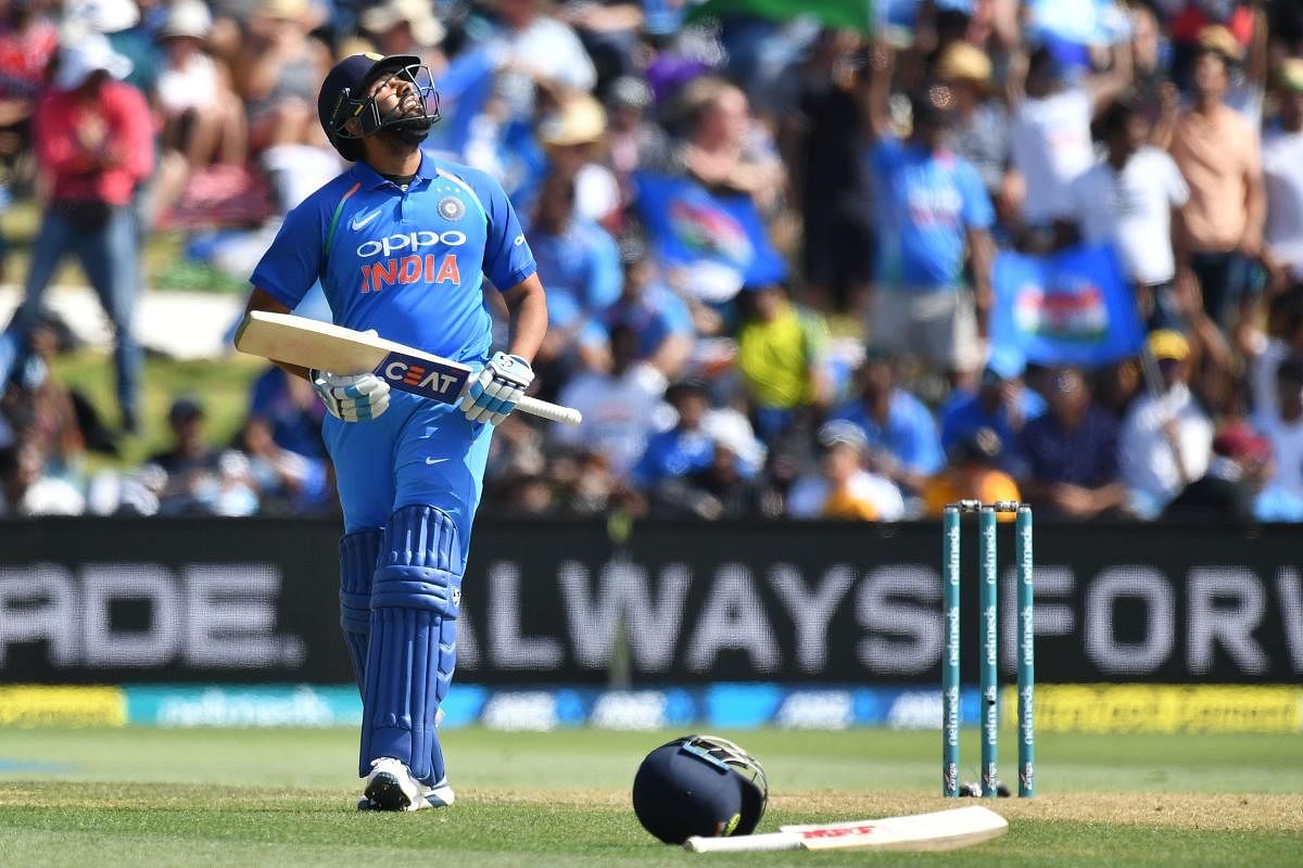 India's Rohit Sharma celebrates reaching his half-century during the second one-day international (ODI) cricket match between New Zealand and India in Tauranga on January 26, 2019. (AFP Photo)