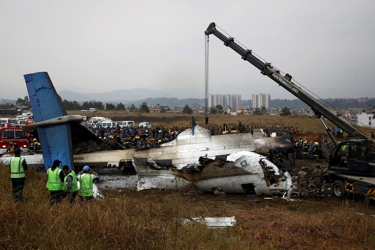 Rescue workers work at the wreckage of a US-Bangla airplane after it crashed at the Tribhuvan International Airport in Kathmandu. (Reuters File Photo)