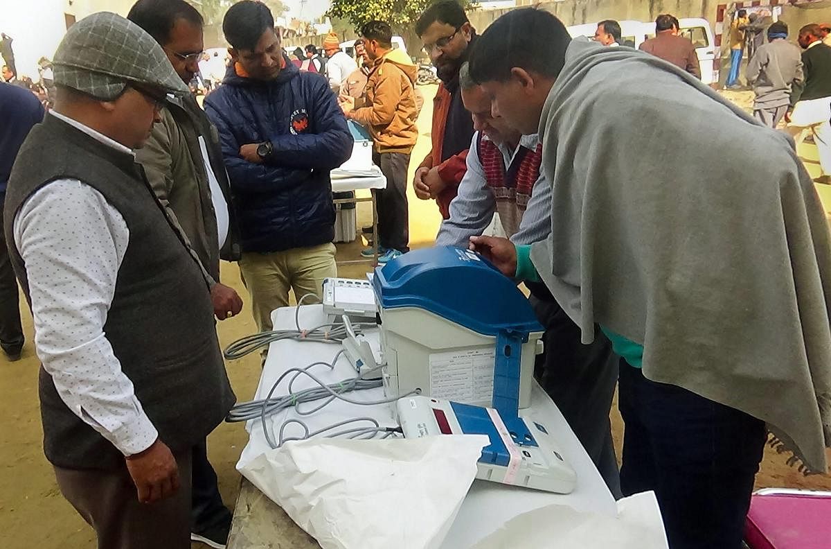 EVM machines being allocated to polling staff on the eve of Jind bypoll elections. PTI file photo.