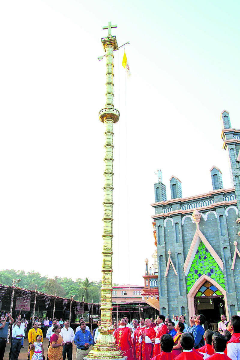 Dignitaries hoist the flag to mark the annual feast of the St Lawrence Basilica at Attur in Karkala on Sunday.