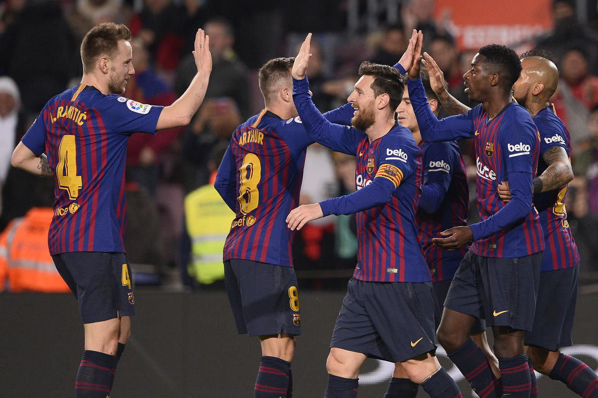 Barcelona's Ousmane Dembele (second from right) celebrates with team-mates after scoring against Levante on Thursday. AFP