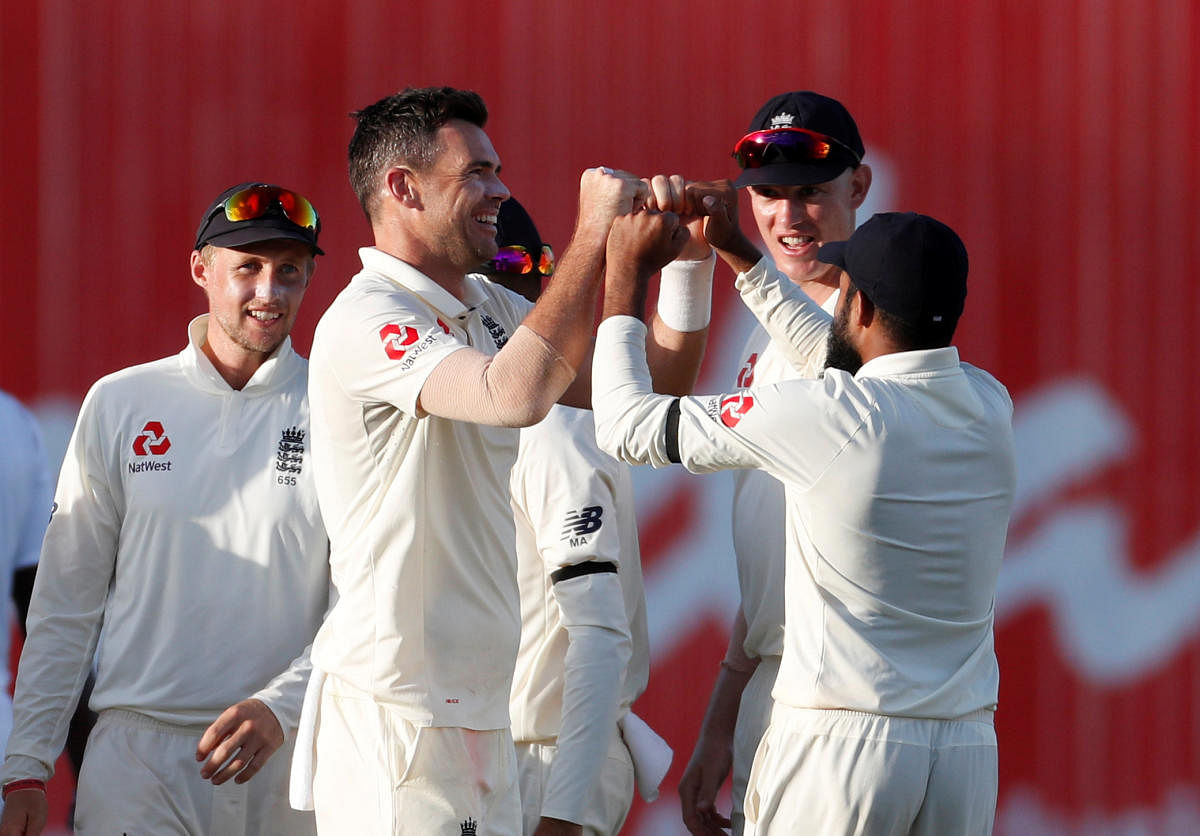 England's James Anderson (second from left) celebrates with team-mates after dismissing West Indies' Jason Holder on Wednesday. Reuters