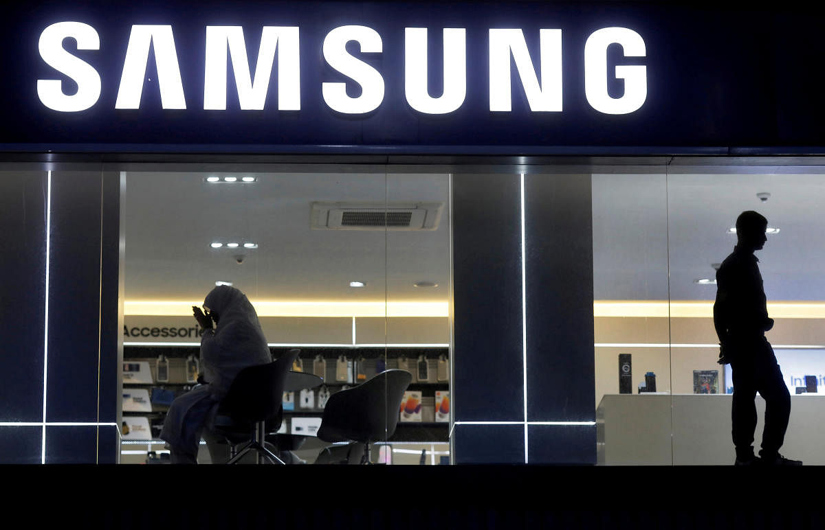 A customer prays inside a Samsung showroom in New Delhi. Reuters file photo