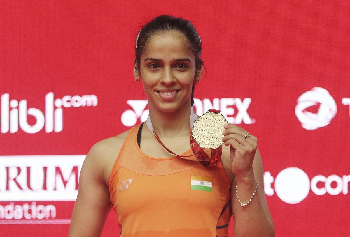 Saina Nehwal with the gold medal after winning the Indonesian Masters on Sunday. AP/ PTI