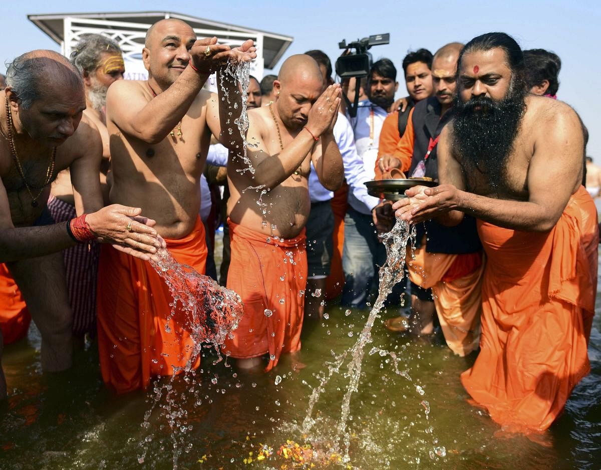 Uttar Pradesh Chief Minister Yogi Adityanath takes a holy dip in the water of River Ganga at Sangam during the ongoing Kumbh Mela-2019, in Allahabad, Tuesday, Jan. 29, 2019. (PTI Photo)