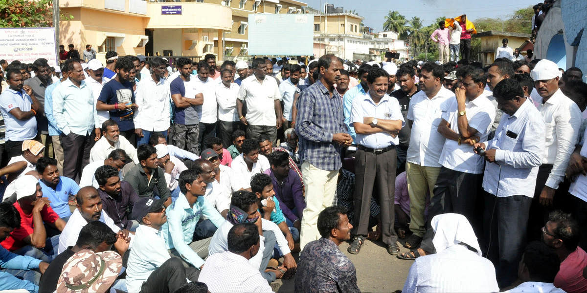 Udupi fishermen stage a protest at Malpe port on Tuesday.