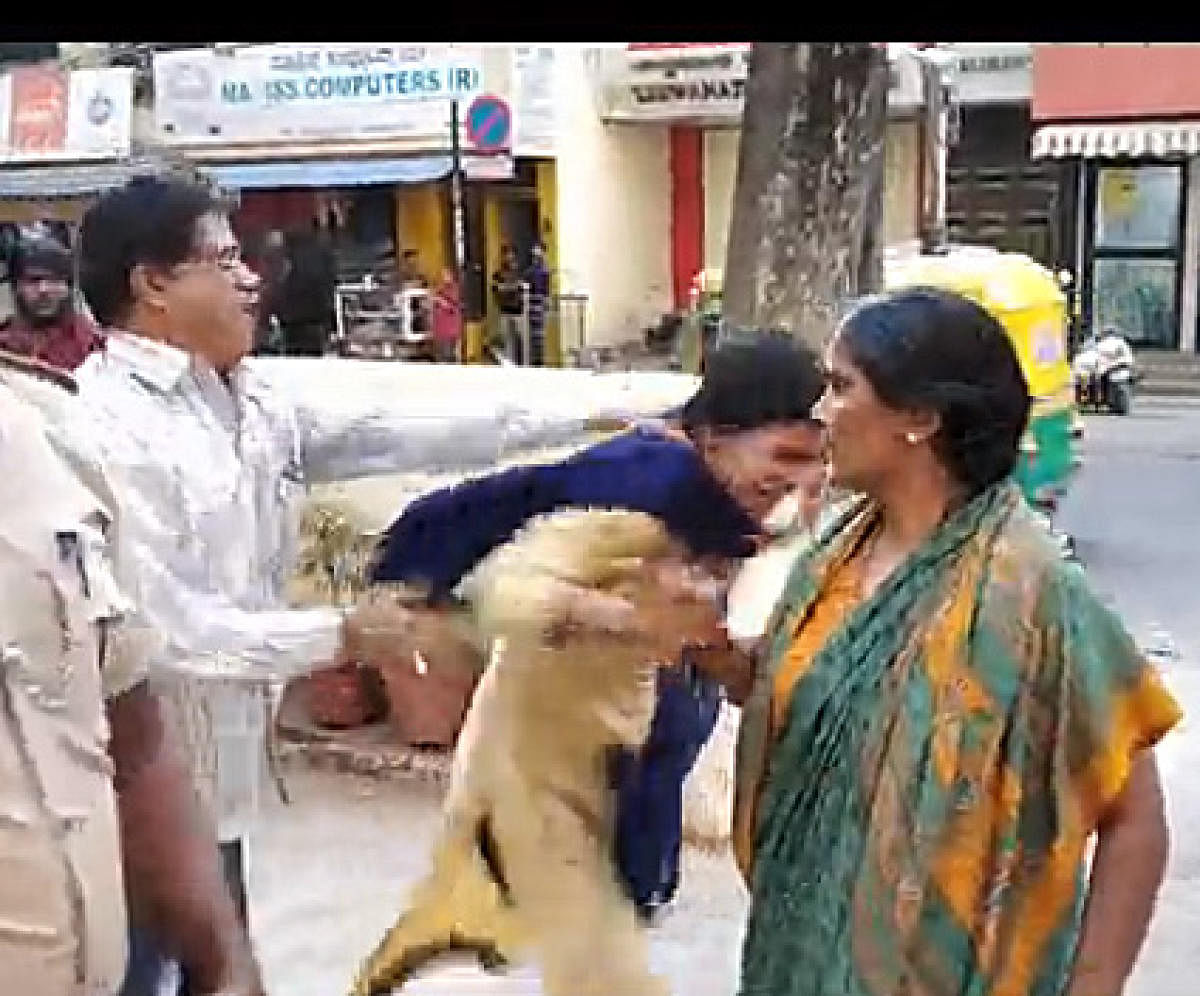 (left to right) Video grab showing ASI Renukaiah assaulting Saraswathi and her mother Rajeshwari at the police station.