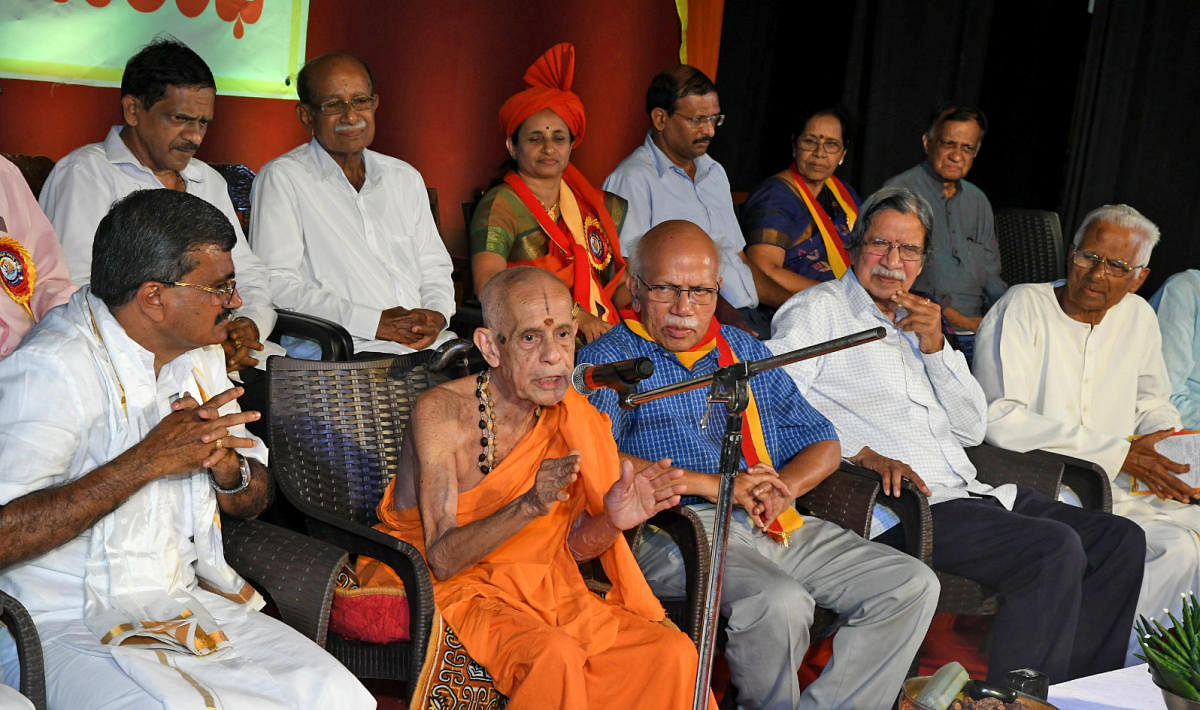 Udupi Pejawar Mutt seer Vishwesha Theertha Swami speaks on the occasion of 23rd Zilla Kannada Sahitya Sammelana at Town Hall in Mangaluru on Tuesday.