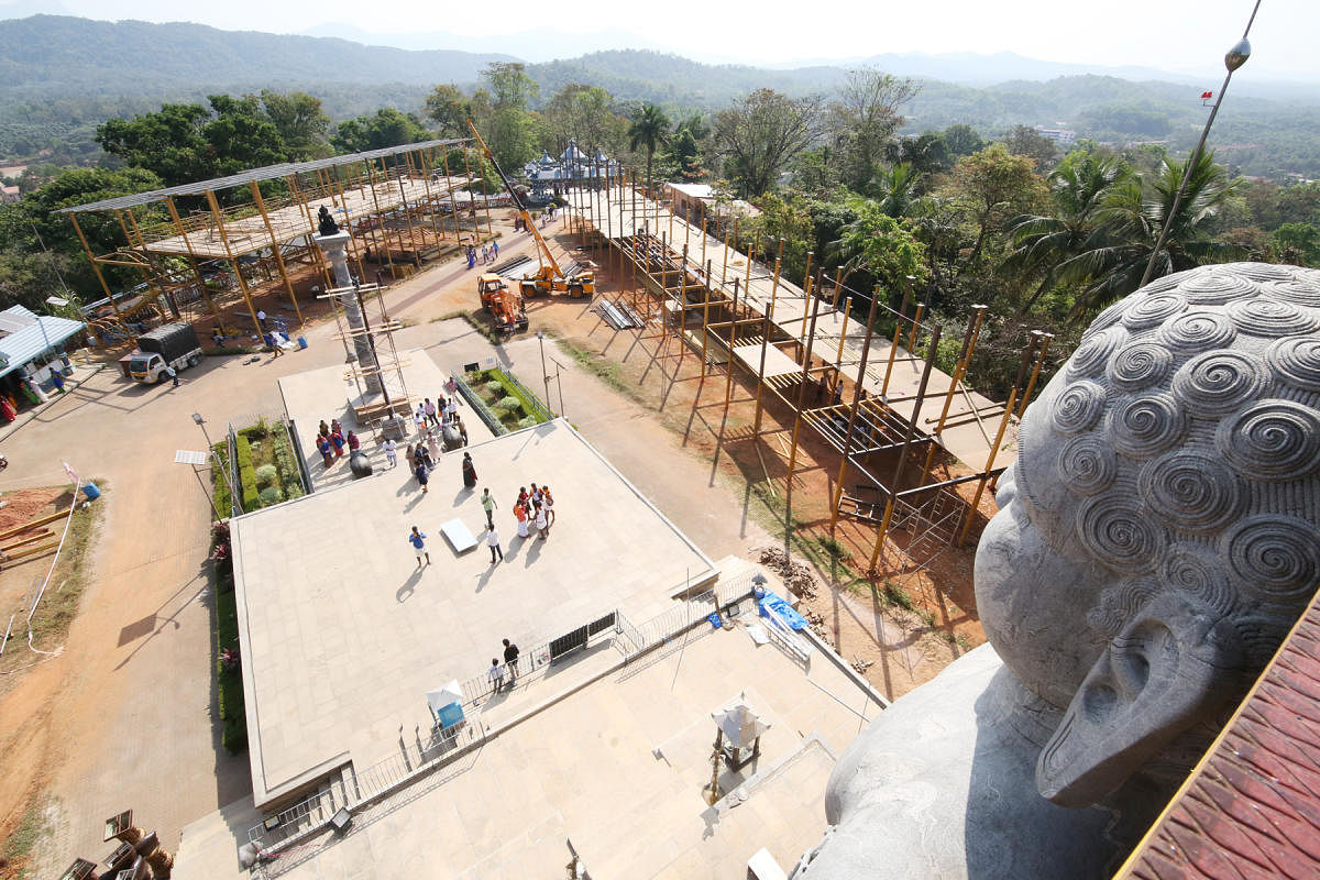The work on scaffolding is in progress for the Mahamastakabhisheka of the Bahubali statue at Rathnagiri in Dharmasthala.