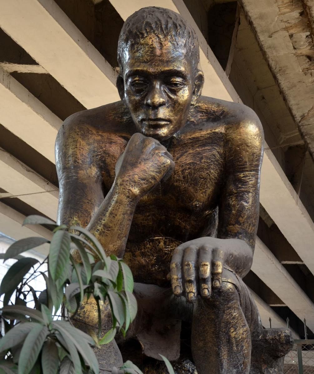 A replica of The Thinker, by French Sculptor Auguste Rodin, under a flyover in Guwahati, as a memorial of a bomb blast in 2008. Photo by Manash Das, Guwahati