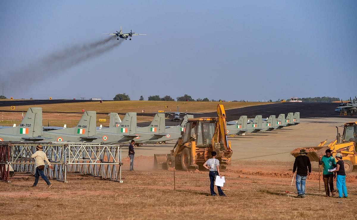 An earthmover clears a path during preperations ahead of 'Aero India Show 2019', at Yelahanka Air Base station in Bengaluru, Wednesday, Jan. 30, 2019. (PTI Photo)