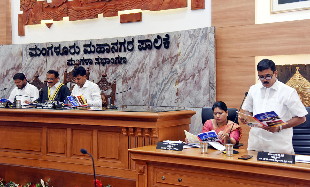 Mangaluru City Corporation Taxation, finance and appeals standing committee chairman Radhakrishna presents the budget for the year 2019-20 at Mangala Auditorium of MCC on Wednesday.