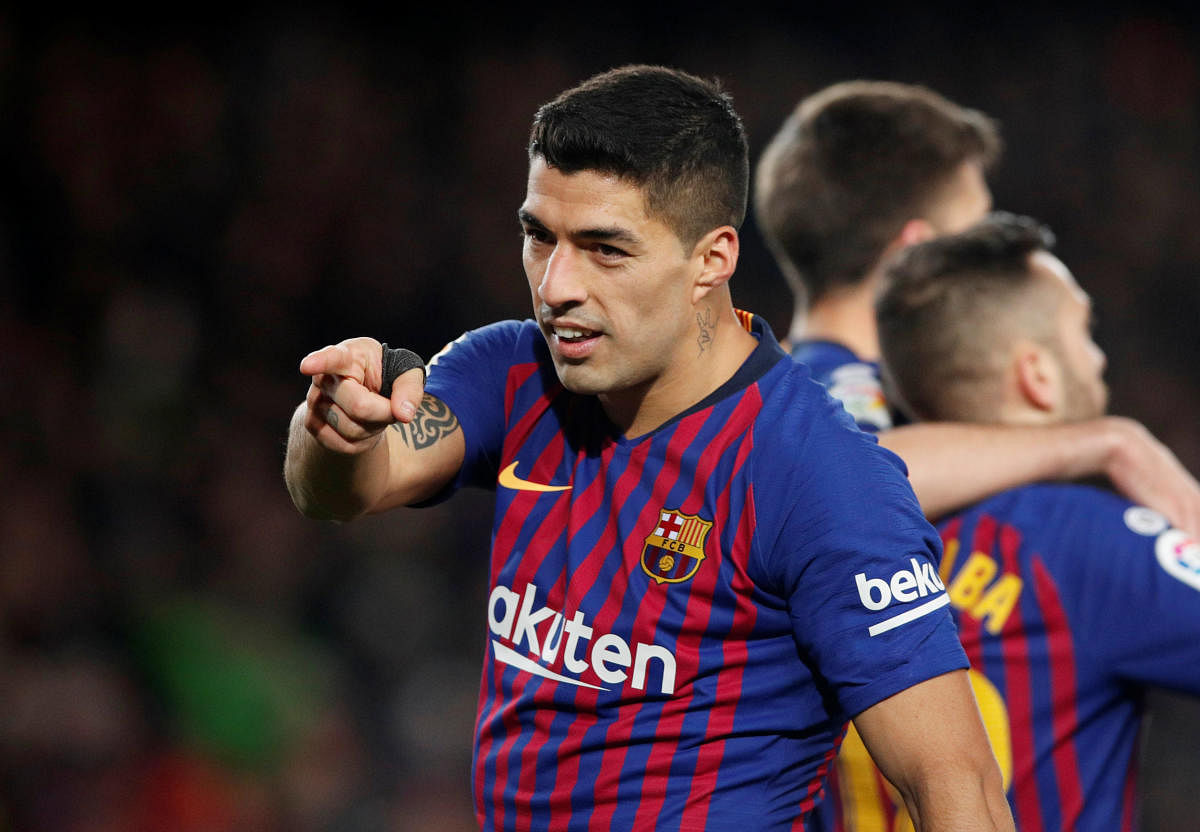 Barcelona's Luis Suarez celebrates after scoring against Sevilla during their Copa del Rey quarterfinal clash on Wednesday. REUTERS
