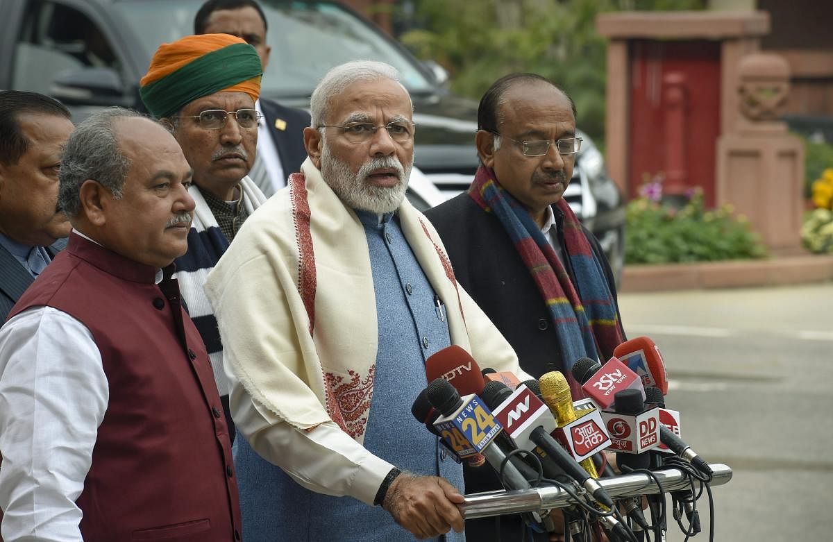 Prime Minister Narendra Modi, flanked by Parliamentary Affairs Minister NS Tomar and Ministers of State Arjun Ram Meghwal, Vijay Goel and Jitendra Singh, addresses the media on the first day of the Budget Session of Parliament, in New Delhi. PTI photo