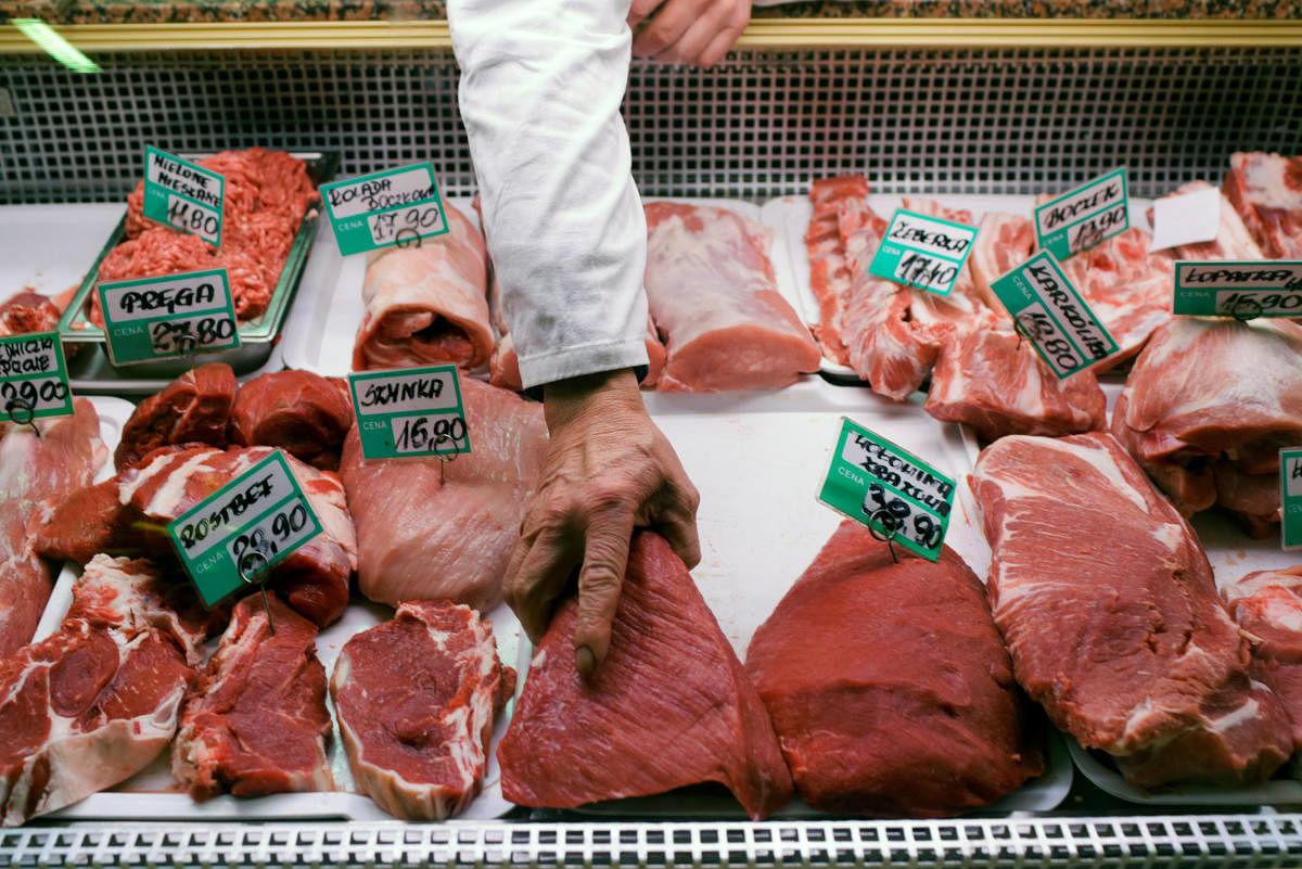 A butcher arranges pieces of beef at a meat market in Gdynia, Poland. January 31 2019. (REUTERS)