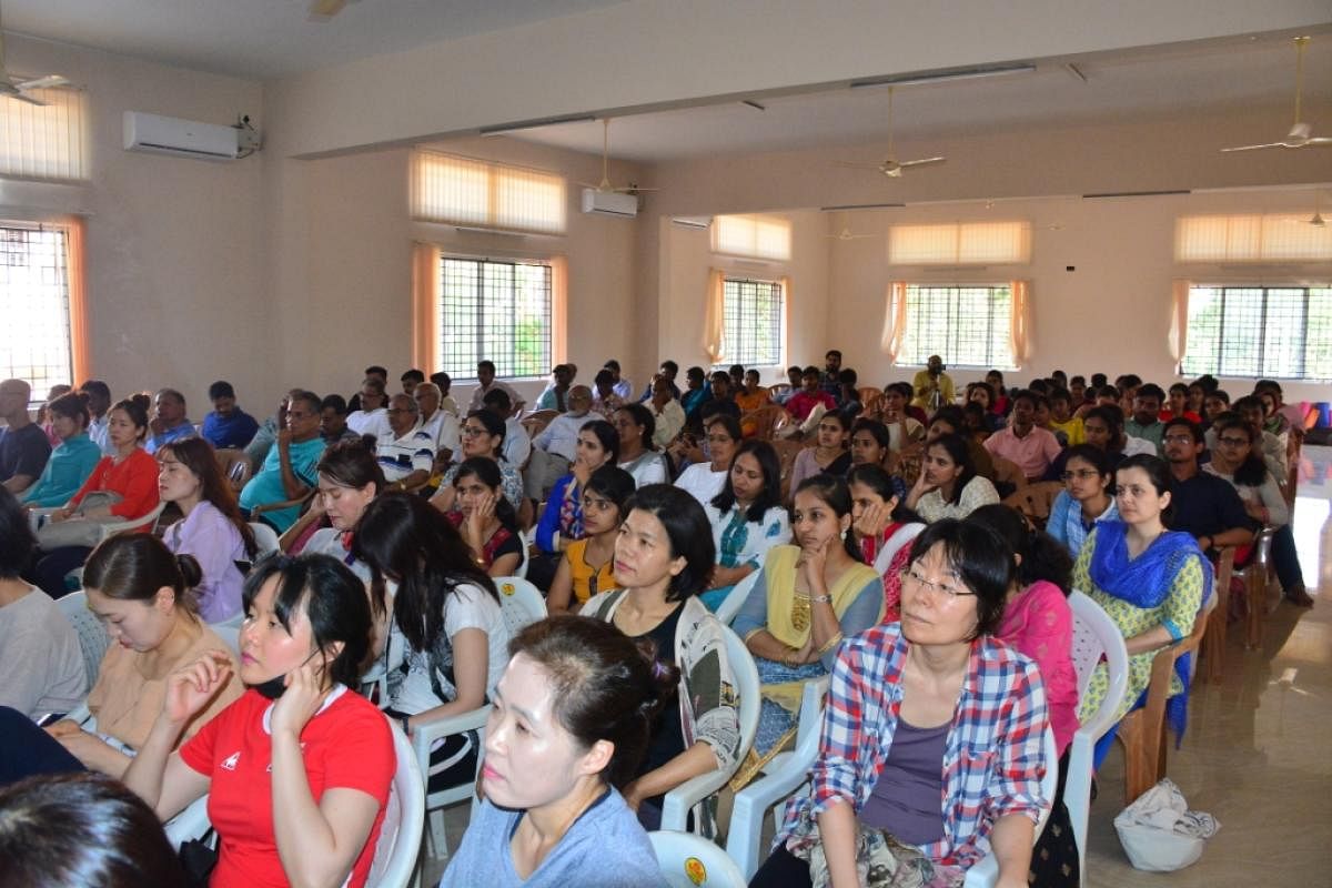 Delegates at the valedictory of international workshop on Yoga therapy organised at the Dr D Veerendra Heggade Seminar Hall of the lecture complex of Mangalore University on Wednesday.