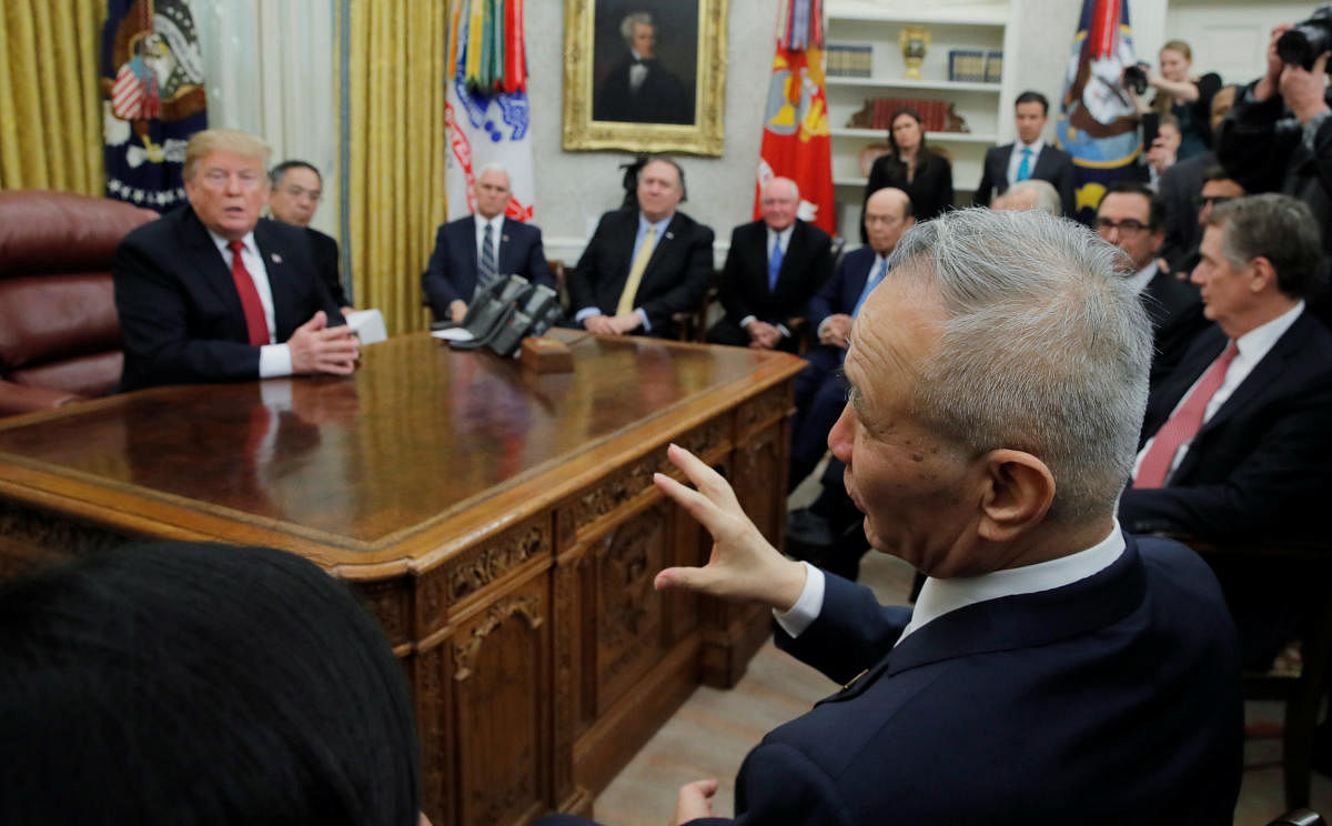 US President Donald Trump listens to China's Vice Premier Liu He (R) in the Oval Office of the White House in Washington. (REUTERS)
