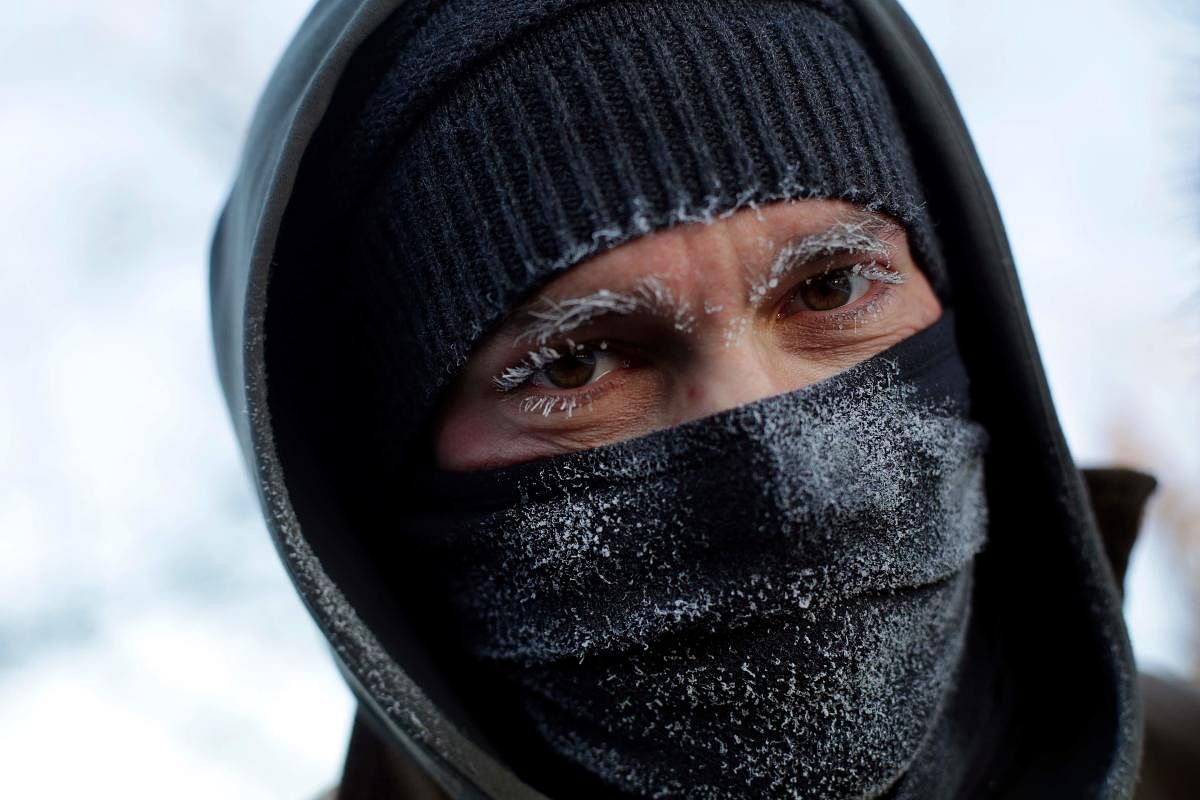 A man's eyebrows and eye lashes are frozen as temperatures dropped to -29 degrees C on January 30, 2019 in Chicago, Illinois. AFP