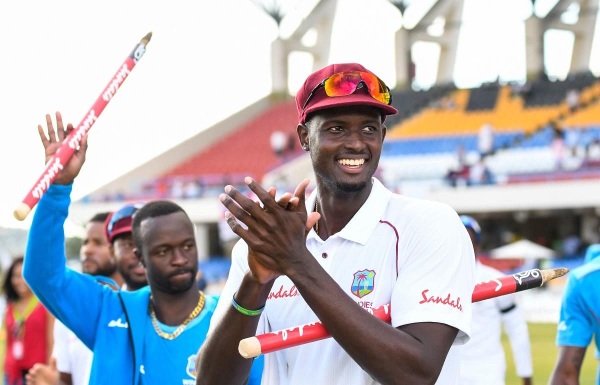 PROUD LEADER: West Indies skipper Jason Holder celebrates after his side clinched the second Test against England by 10 wickets on Saturday. AFP