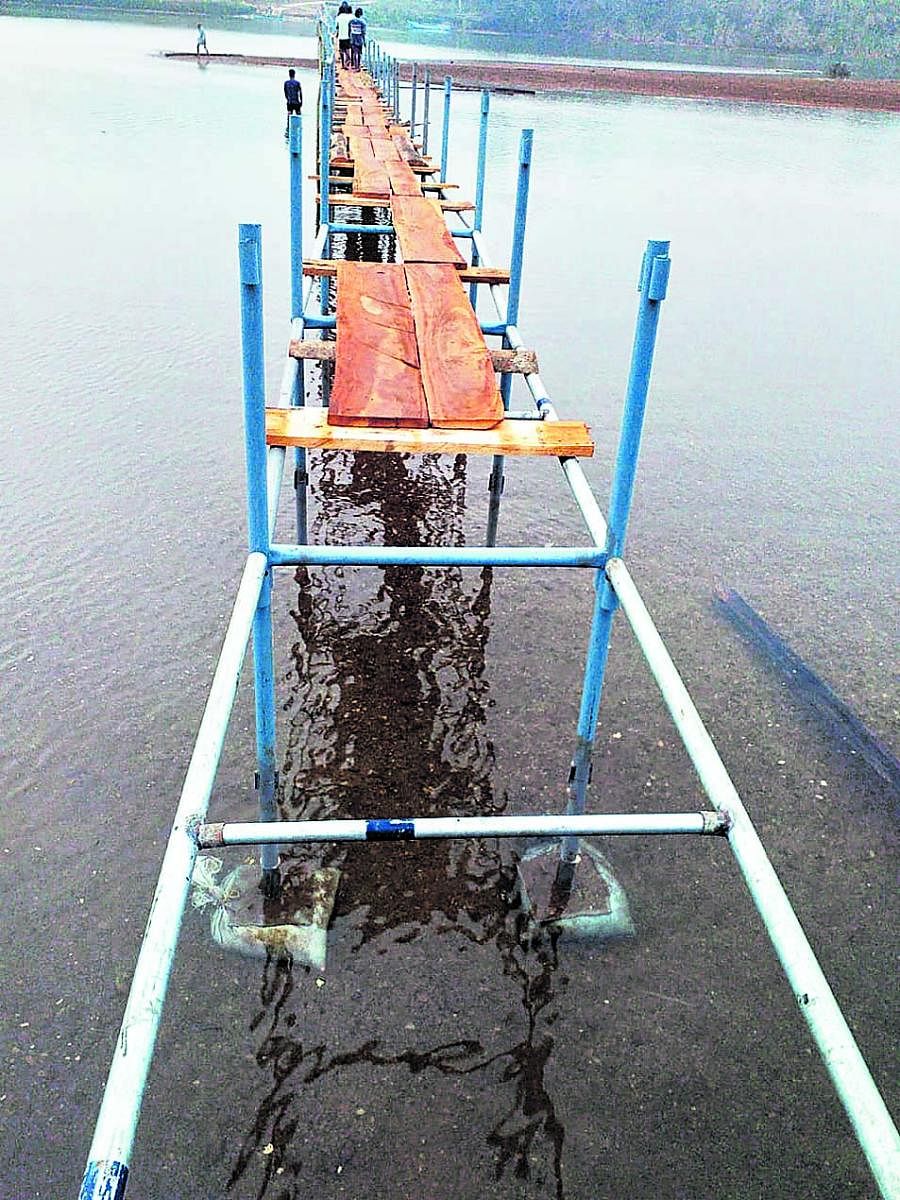 The temporary bridge, built by the residents of Pavoor Uliya, damaged by miscreants.