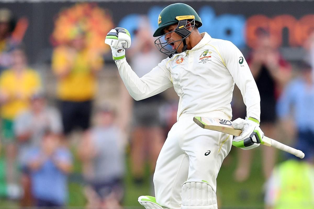 Australia's Usman Khawaja celebrates his century on the day three of the second Test against Sri Lanka in Canberra on Sunday. AFP