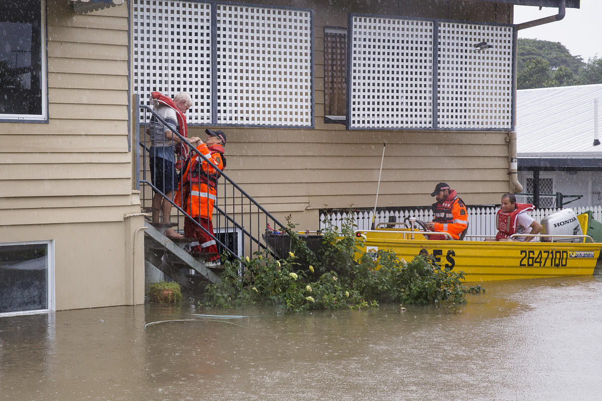 SES volunteers are seen rescuing residents in Rosslea, Townsville, Queensland, Australia. Reuters/AAP.