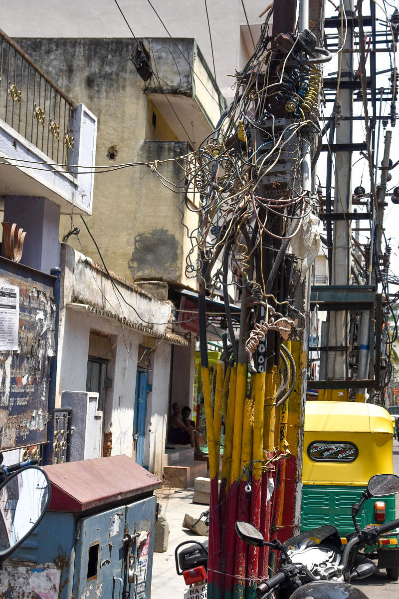 All such dangerously hanging overhead power cables will be eliminated in three years. DH FILE PHOTO